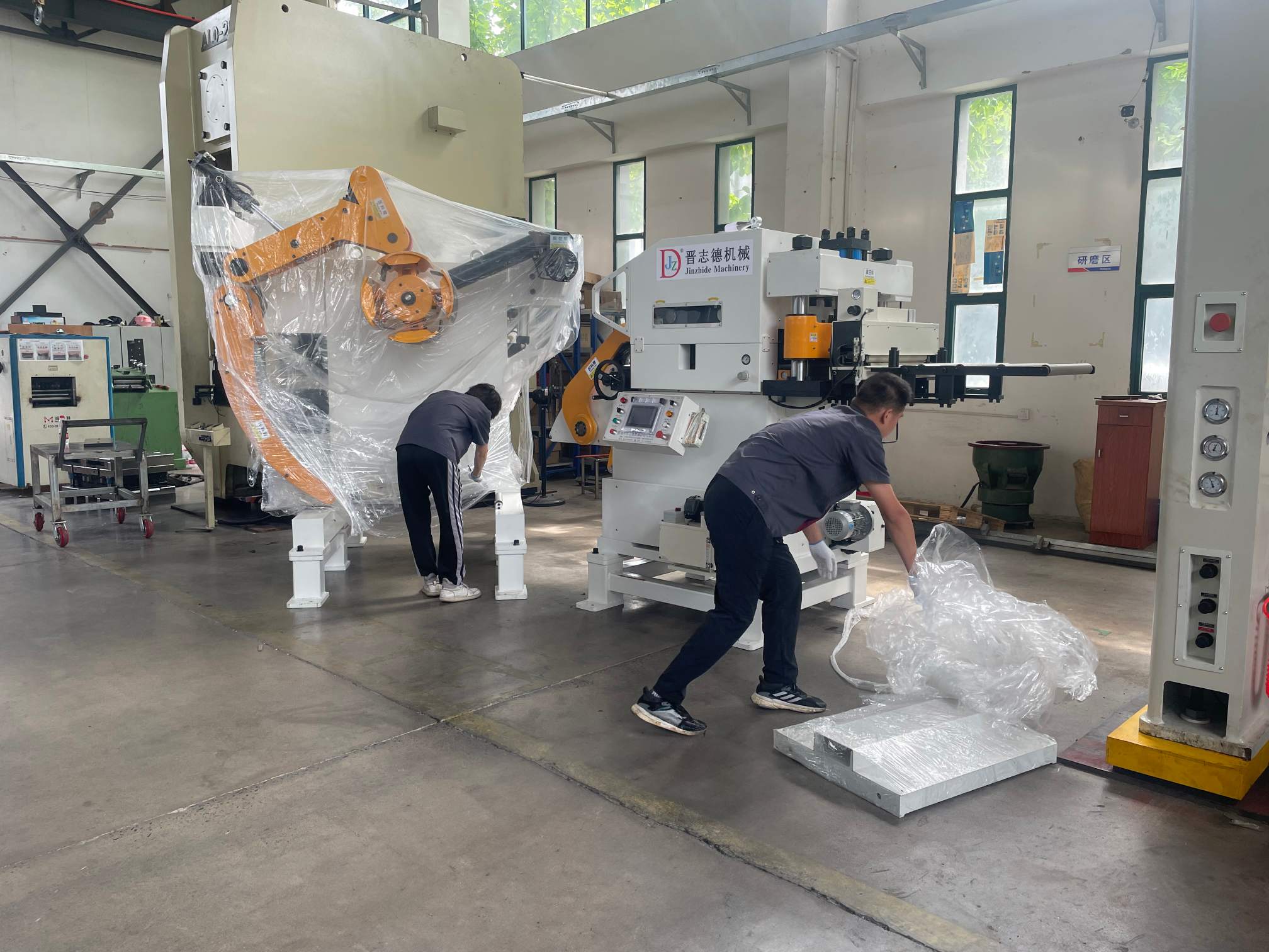 Decoiler straightener feeder positioned and aligned with stamping press in Vietnam